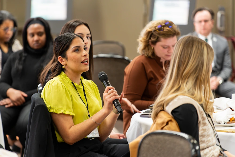 Jasmanpreet Kaur, a fourth-year medical student in the MSU College of Human Medicine, speaks during the conference. Photo credit Bryan Esler.
