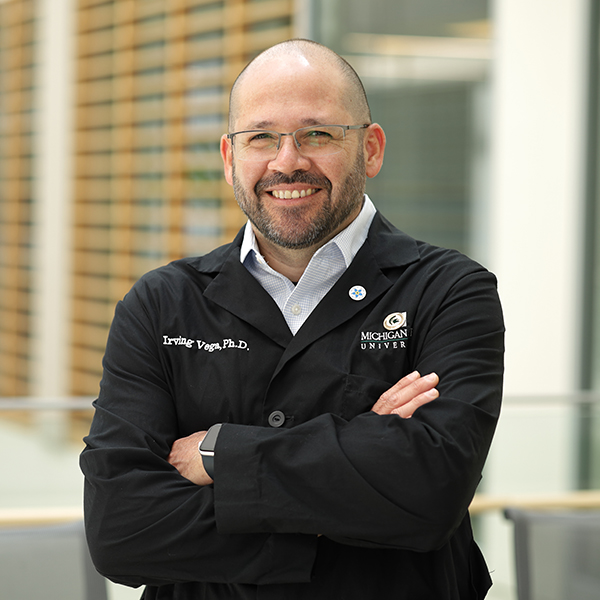 Irving Vega standing in the research center.