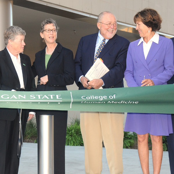 From left to right: President Lou Anna K.Simon, Dean Marsha Rappley, Peter and Joan Secchia, at the ribbon cutting for the Secchia Center.