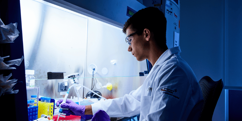 Researcher testing samples in a lab.