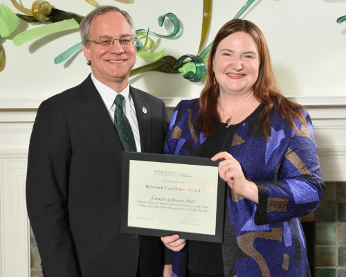 Jennifer Johnson, PhD,  posed with dean Sousa and their department chair.