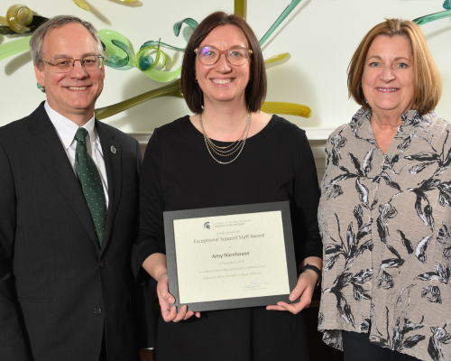 Amy Nienhouse  posed with dean Sousa and their department chair.