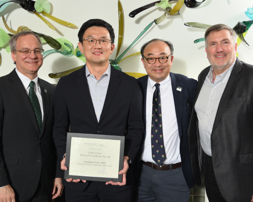 Sangbum Park, PhD, posed with dean Sousa and their department chair.