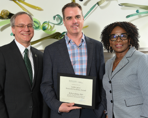 Robert Quinn, PhD,  posed with dean Sousa and their department chair.