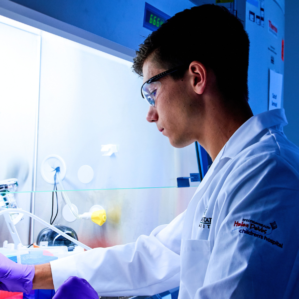 A scientist working at a lab bench.