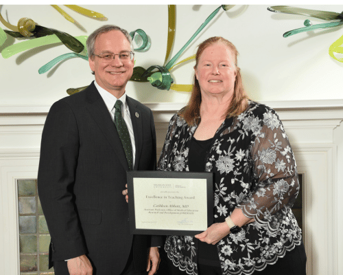 Cathleen Abbott receiving her award.