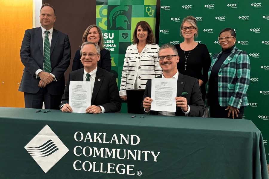 (L-R back row) Mark Largent, vice provost for undergraduate education and dean of undergraduate studies for MSU, Amber Heard-Booth, PhD, interim assistant dean of admissions for MSU College of Human Medicine, Jennifer Berne, PhD, OCC provost, Jolene Chapman, OCC associate provost, Arlynn Dailey, community engagement and outreach administrator-Detroit for MSU College of Human Medicine. (front row) Aron Sousa, MD, dean, MSU College of Human Medicine, and Peter Provenzano Jr., chancellor of Oakland Community College.