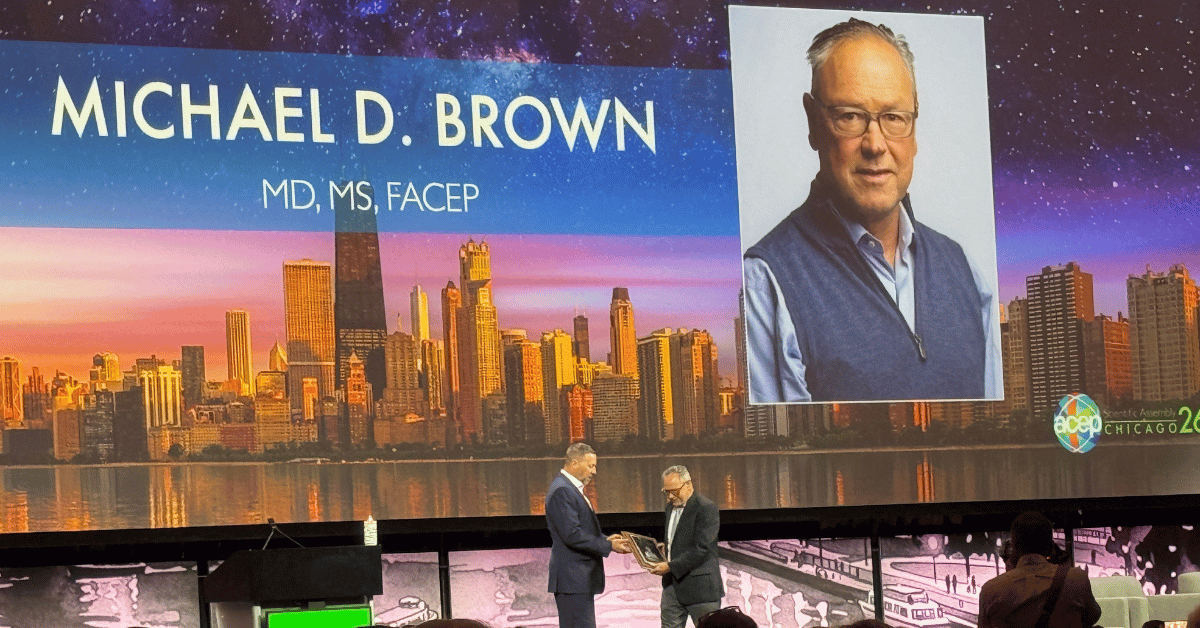 mike brown accepting the acep award.