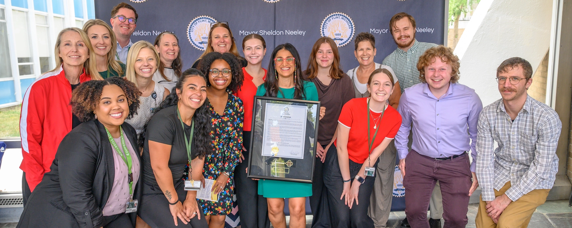 Mona Hanna, center, from Michigan State University, accepted a key to the city of Flint on July 30. This is one of Flint’s highest honors and is reserved for those whose leadership and service leave a lasting impact. Photo by Josh Kennedy, Michigan State University.
