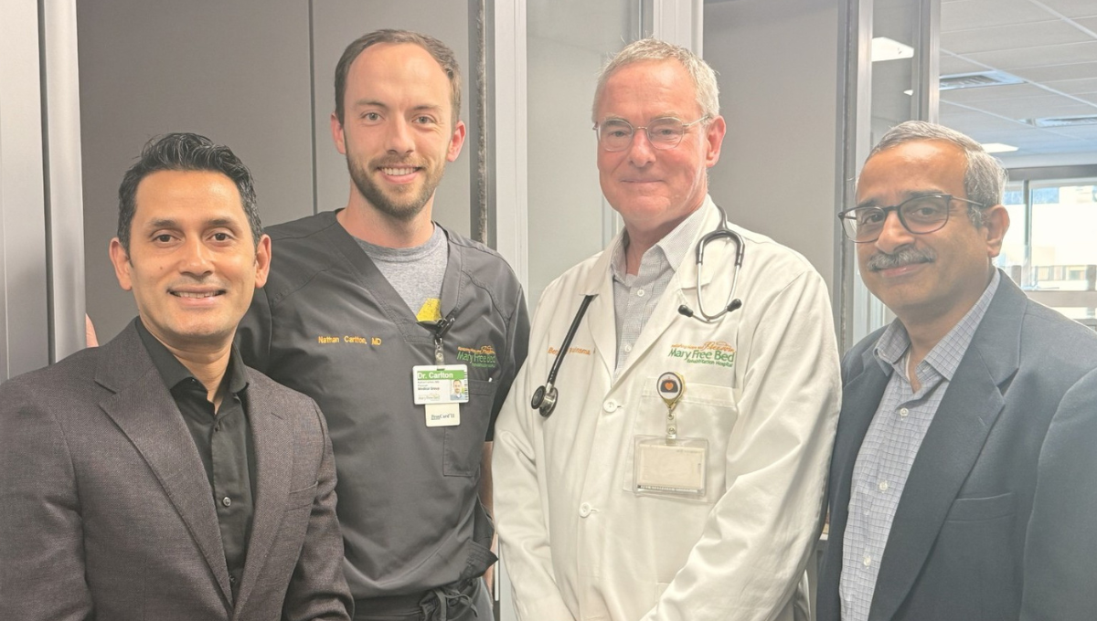 Dean Rayamahji, Nathan Carlton, MD (‘19), alongside Benjamin Bruinsma, MD, clinical assistant professor in the Department of Medicine and chief medical officer at Mary Free Bed, and Associate Dean Nara Parmaswaran.