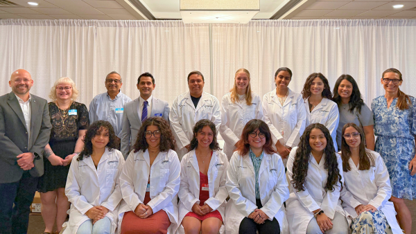 A group shot of the participants in Bridge to PhD in Neuroscience Program (BPNP) Lab Coat Ceremony.