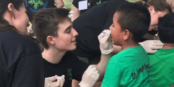 Nick working with a child in Belize.