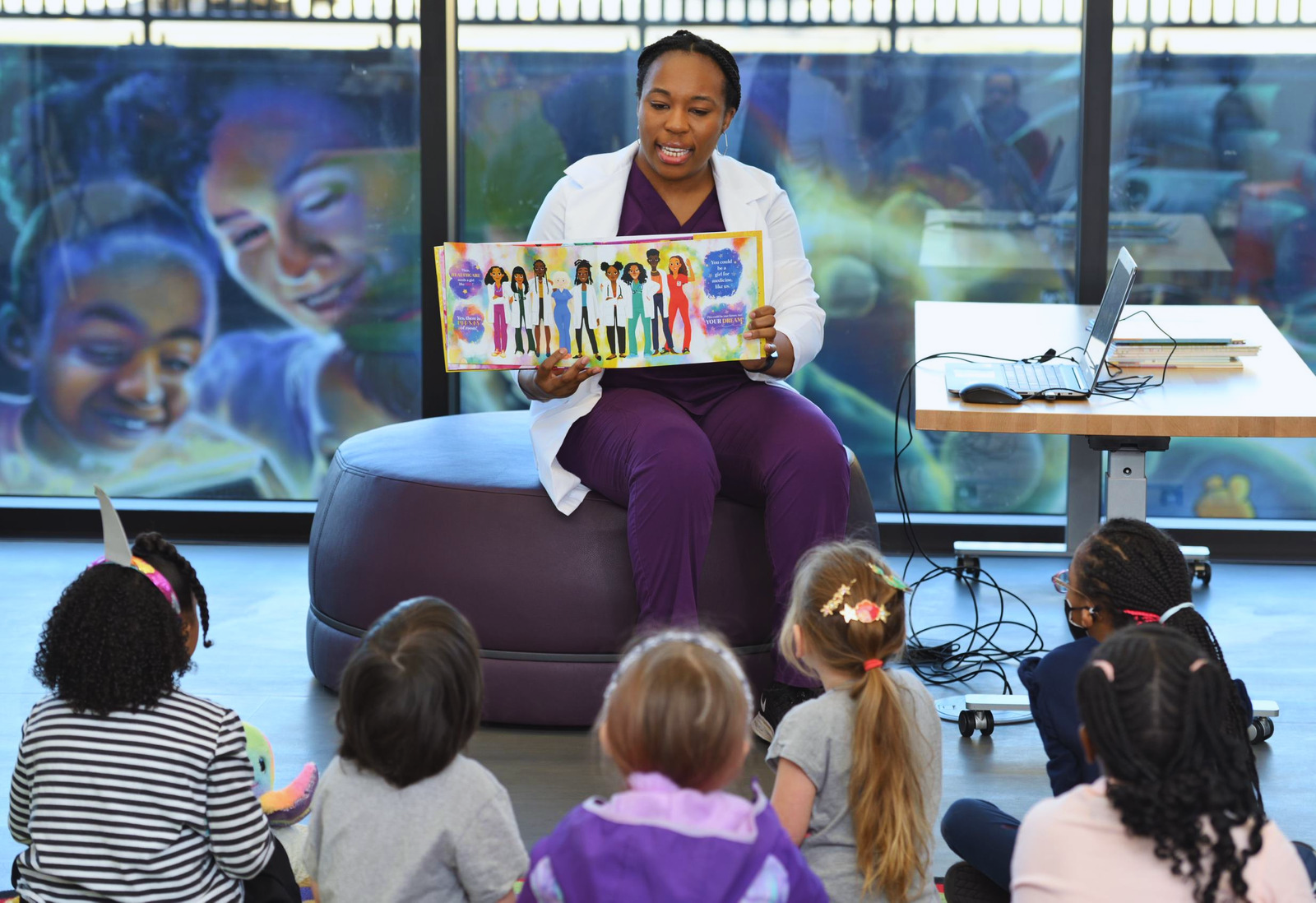 Future Dr. Rezi reading to children.