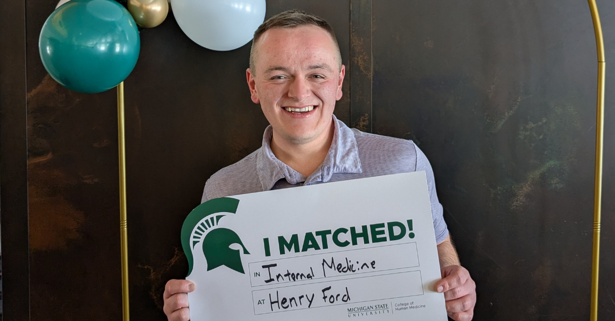 Dennis Boynton holding his match day sign