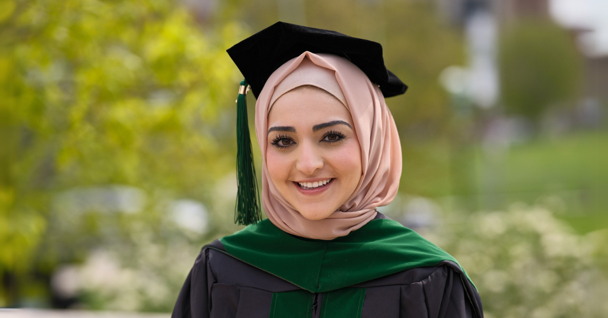 Rawan Hammoud holding her match day sign.