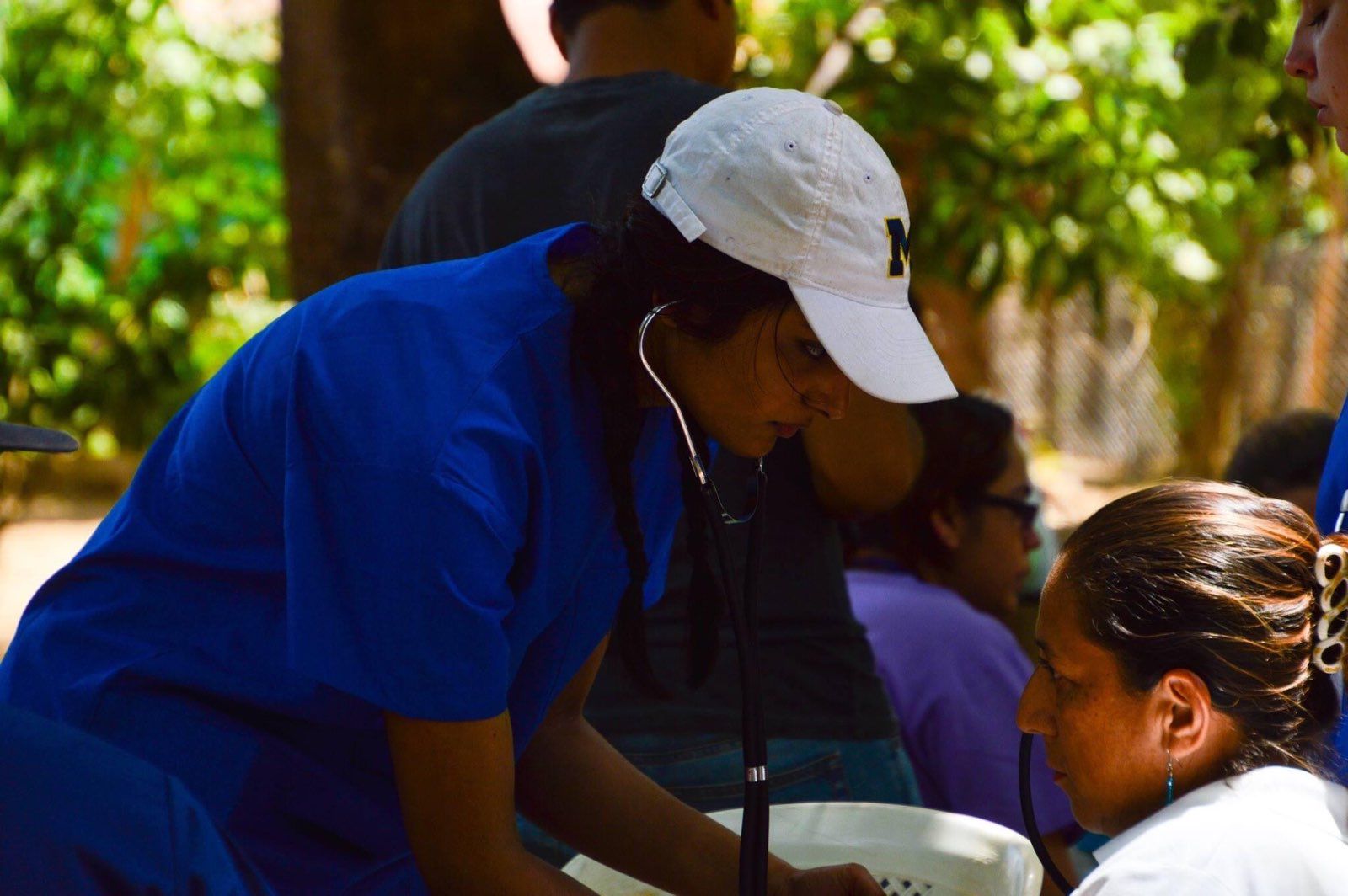 Sejal working with a patient.