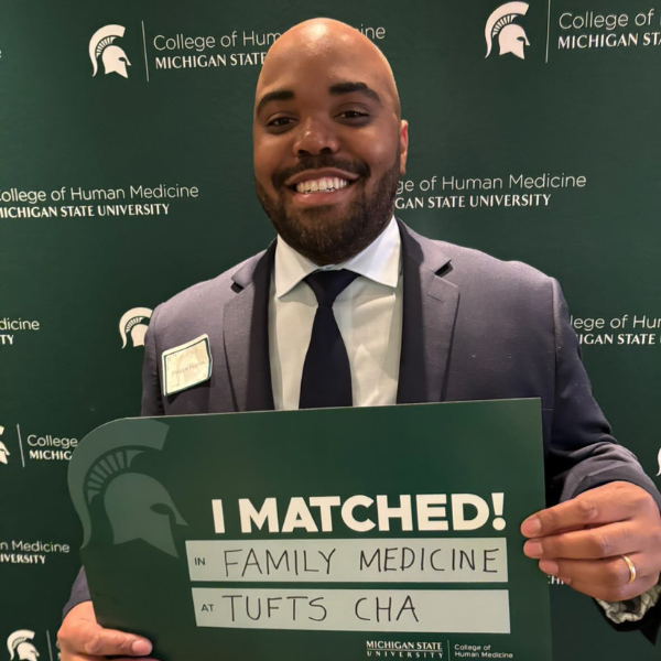 Phil Moleus holding his match day sign.