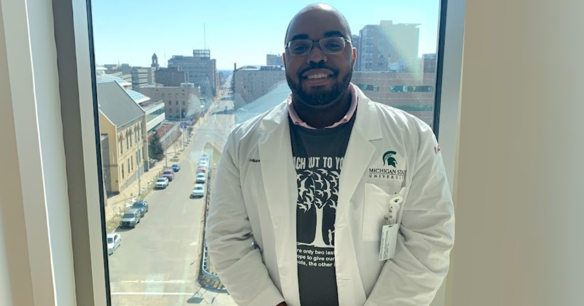 Philippe Moleus in his white coat during the Reach Out to Youth event.