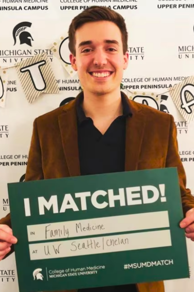 Nick holding his match day sign.