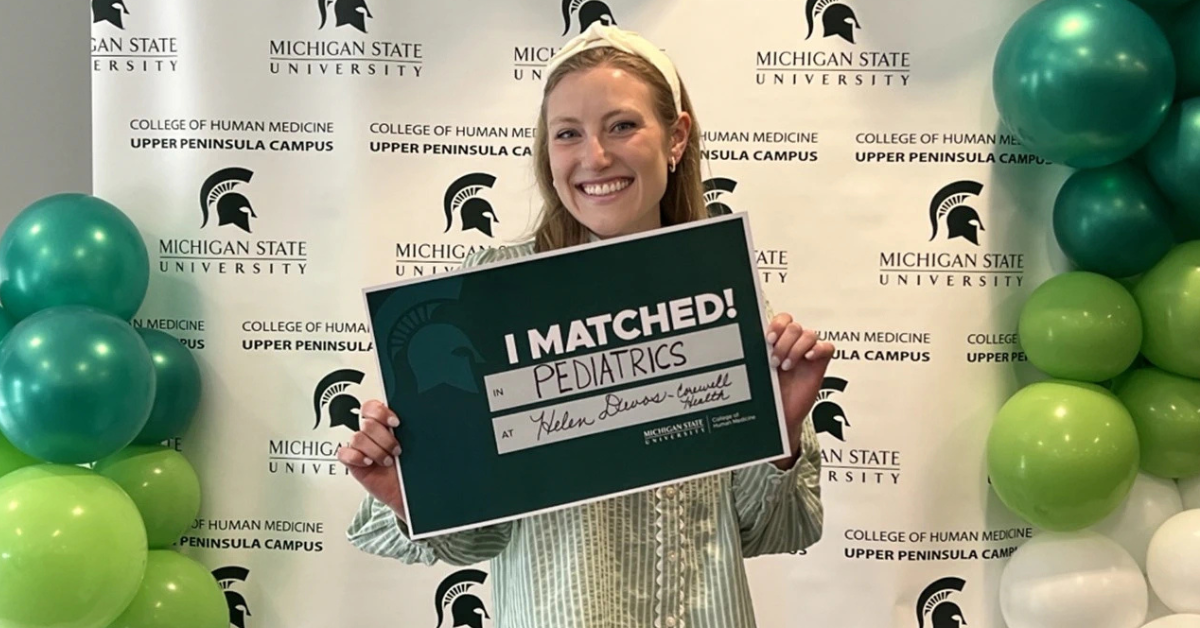 Karmyn Vickery holding her match day sign.