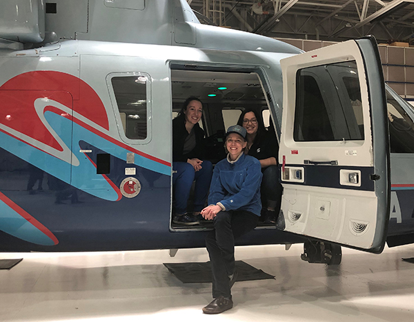 Kendall Stevens, MD candidate, sitting in a helicopter