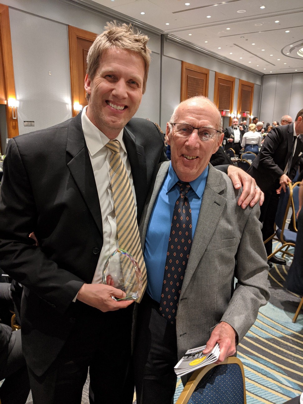 Dr. Eric Achtyes and his father at an award banquet