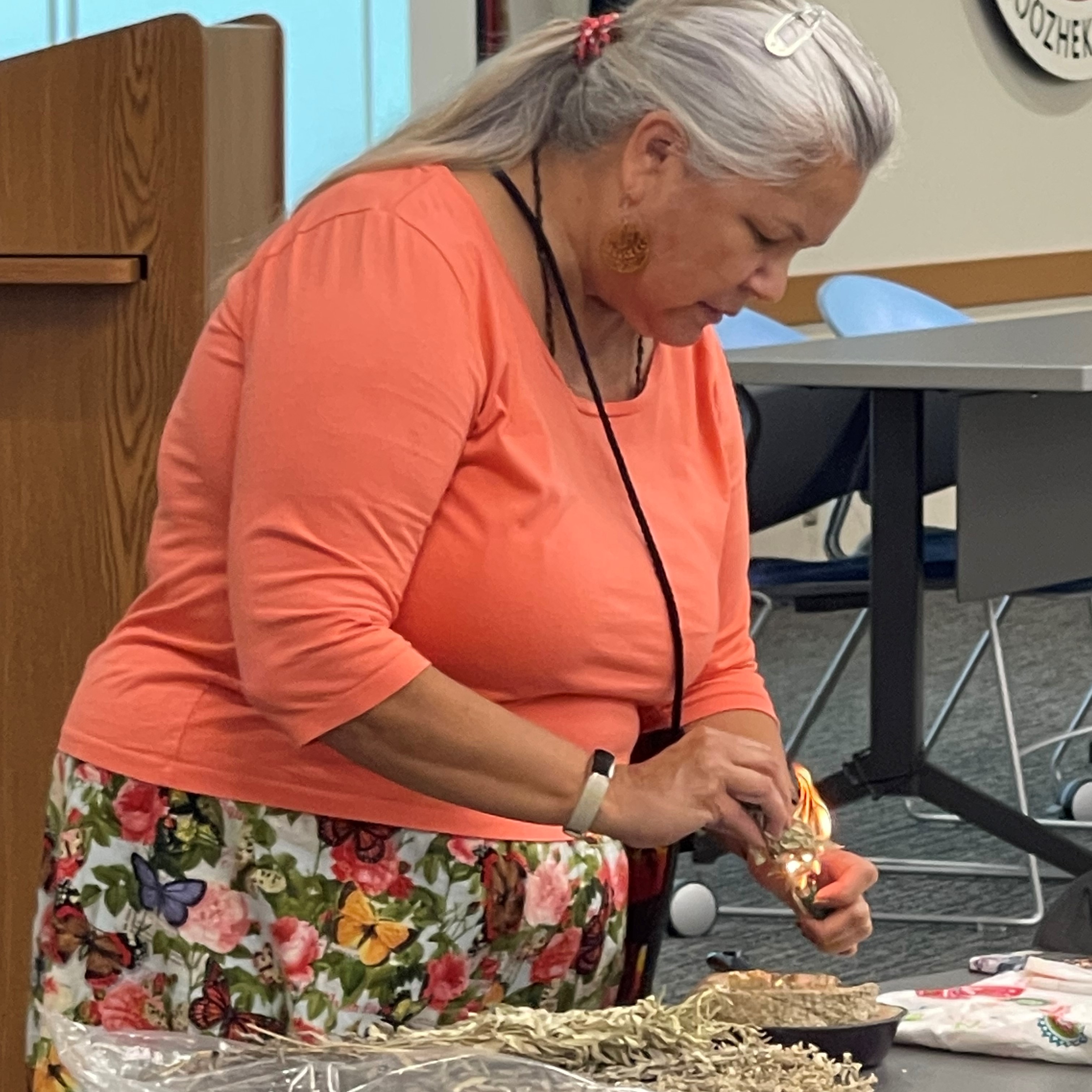  Michele Wellman-Teeple, Anishinaabemowin Pane Immersion Program faculty and director at Bay Mills Community College, performs smudge/prayer in the Anishnaabemowin language.