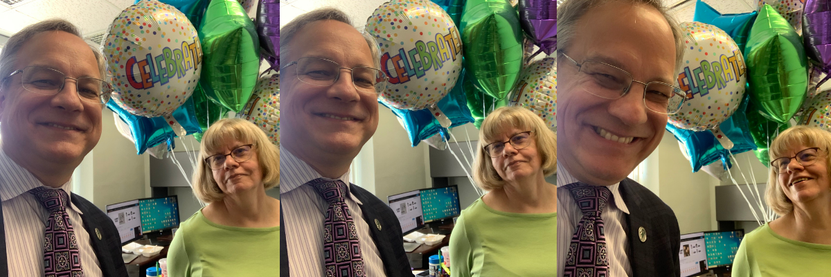 Aron convinces Mary Ellen to do a selfie with him. He takes a series. 