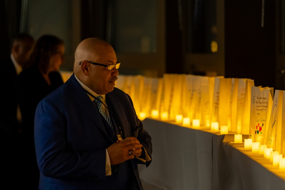 From the right: Paster Kinzer Pointer and Andrea Wendling view remembrance luminaries at the conference.