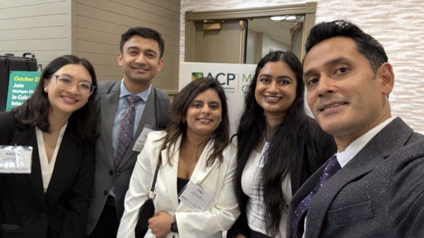 Dean Rayamajhi with students at the Michigan Chapter of American College of Physicians.  