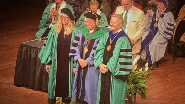 Chaz Hong being honored at the university investiture.