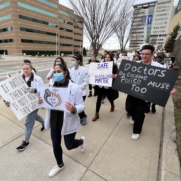 Group of students and faculty participating in "White Coats for Black Lives: Justice for Patrick Lyoya"