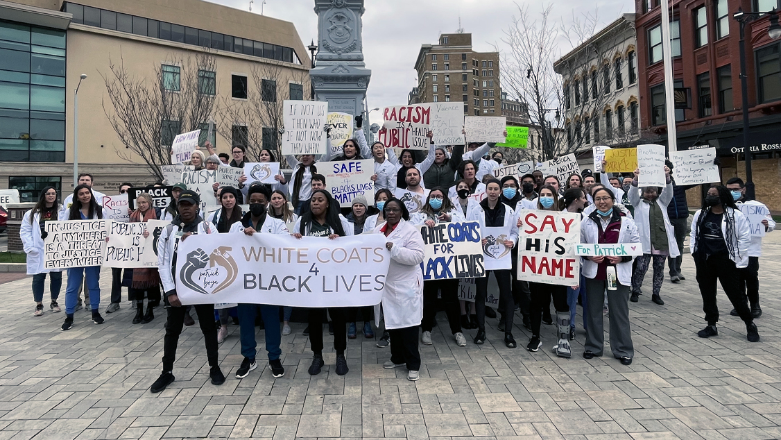 Group of students and faculty participating in "White Coats for Black Lives: Justice for Patrick Lyoya"